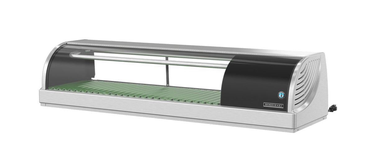 A Hoshizaki refrigerated sushi case with stainless steel and glass construction, curved front, green ridged tray, and side ventilation. This countertop display case features a clear top, horizontal metal bar, and is empty but plugged in.