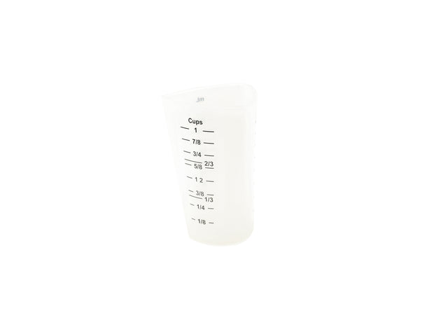 A translucent silicone measuring cup marked with black measurement lines and labels for cup fractions from 1/8 to 1 cup. The dishwasher safe cup stands upright on a white background.
