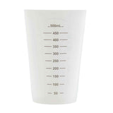 A transparent measuring cup with black milliliter markings from 50 mL to 500 mL, crafted from dishwasher safe plastic, displayed against a plain white background.