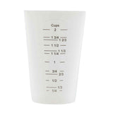 A white plastic measuring cup with black measurement markings, showing increments from 1/4 cup to 2 cups and fractional labels. This dishwasher safe measuring cup is empty and stands upright, ready for use in any kitchen task.