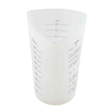 A translucent white silicone measuring cup, dishwasher safe, with blue markings for milliliters, ounces, and cups. It features a wide, rounded opening and a pointed spout for easy pouring.