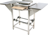 A commercial dough sheeter with stainless steel surfaces, extended side trays, adjustable rollers, and control knobs—perfect for flattening dough in bakeries or kitchens. Pairs well with a Hobart Hand Wrap Station for efficient 20 film capacity packaging.