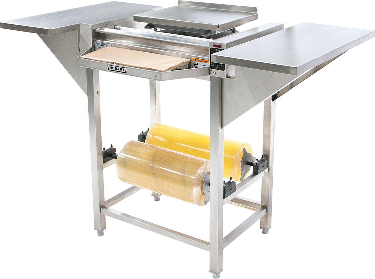 The Hobart Hand Wrap Station features a stainless steel flat workspace, center heat plate, and front cutting blade. Designed for commercial food packaging, it accommodates 20 film capacity rolls mounted below and stands sturdily on four legs.
