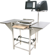 A Hobart stainless steel commercial food slicer with a 20 film capacity and attached touchscreen control panel. The Hand Wrap Station features flat work surfaces, a drawer beneath the slicing area, and metal frame legs with rollers and support bars.
