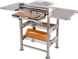 A stainless steel commercial dough sheeter with two side tables, roll film capacity, a roller mechanism on top, digital controls, a safety guard, and an orange rolling pin stored underneath. The Hobart machine is ideal for bakery or kitchen use.