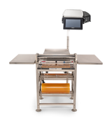 A stainless steel Energy Smart Hand Wrap Station features a tray sealer with heated seal plate, two side shelves, a touchscreen monitor above, and yellow roll film capacity below. The equipment stands on adjustable feet against a white background.