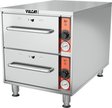 A Slim-Line Warming Drawer in stainless steel, this free standing unit features two pull-out drawers, side control panels with black knobs, temperature dials with orange accents, and a Vulcan logo on top left—all supported by four sturdy metal legs.