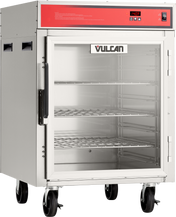 A mobile stainless steel Holding/Transport Cabinet on wheels with a red control panel, digital display, and the door open to reveal three metal wire shelves. The Vulcan brand label is visible inside the cabinet.