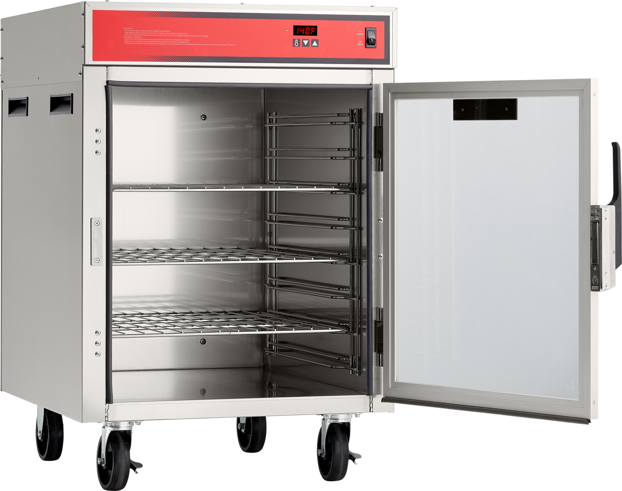 A mobile stainless steel Holding/Transport Cabinet stands on four wheels, its glass door open to reveal three wire shelves inside. The cabinet features a red control panel on top displaying temperature and buttons, and the interior is empty.
