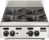 A stainless steel Vulcan gas countertop hotplate features four heavy-duty open burners with black control knobs on the front panel. The brand name “Vulcan” appears on a metal plate, highlighting its professional, commercial design.