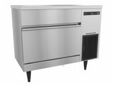 A commercial Hoshizaki stainless steel ice storage bin with black adjustable legs, a horizontal handle, and a digital control panel on the upper right. This undercounter ice maker features a smooth, reflective surface and a vent below the control panel.