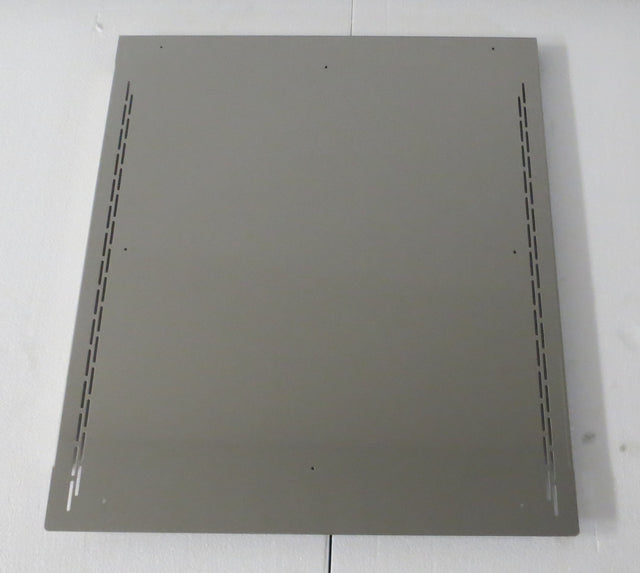 A rectangular metal sheet with a matte gray finish, featuring four small holes near each corner and two rows of elongated ventilation slits along the left and right edges, serves as a bin adapter for a 30" head on 48" bin from Icetro America.
