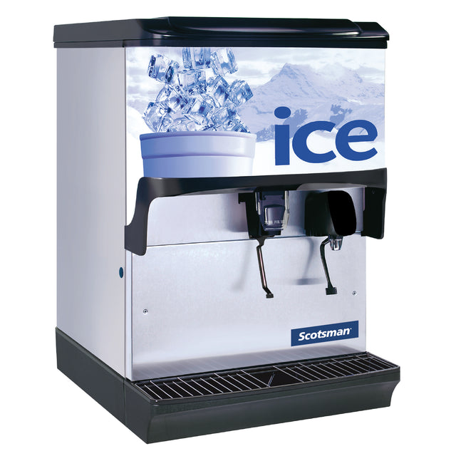 A commercial Scotsman ice dispenser with a silver body and black base, this counter model features a 150 lb storage capacity. The front displays a graphic of a cup filled with ice over a snowy mountain background and bold blue "ice" lettering.