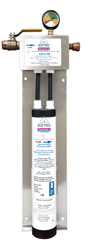 A wall-mounted ice machine water filter system, the ICEPRO 2500 by Icetro America features two black hoses, a pressure gauge with colored sections, brass fittings, and a white cylindrical filter with blue text and company logos.
