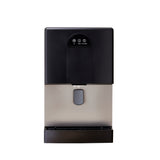 A modern silver and black ice and water dispenser features a touch control panel, a spout for dispensing water, and a drip tray below, set against a white background.