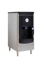 A sleek, modern floor model ice dispenser in silver and black stands on four metal legs. The front features a dispensing area, lever, and the round blue and white ICETRO logo. Ideal as a hotel ice dispenser with 141 lb ice storage capacity.