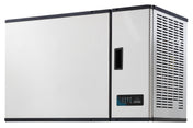 A large, rectangular high capacity ice maker with a vented panel, digital display, and handle on the front. The unit is wall-mounted, featuring a modern, industrial look with clean lines and a white front panel.