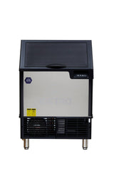 A cube-style ice maker featuring a stainless steel exterior, black top and sides, control buttons on the upper right, ventilation grill and labels at the bottom, four metal legs, and a faint brand logo on the closed door.