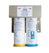 Two cylindrical water filters from the IcePro Series with white bodies and colored bases (yellow and blue) are mounted vertically on a metal bracket. Each filter features a label with instructions, while the top displays ICETRO America’s contact info.