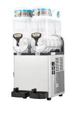 A stainless steel and plastic dual-tank frozen beverage dispenser from Icetro America, featuring two clear containers with PULL-labeled taps. Colorful slush drink images adorn the lids, while vents, a control panel, and drip trays complete the slush machine.
