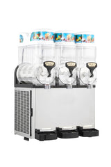 An Icetro America frozen beverage dispenser with three clear, cylindrical drink containers sits on a stainless steel base. Each slush machine container features colorful fruit graphics, black and silver levers, and matching drip trays below each dispenser.