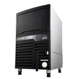 A commercial cube-style ice maker with a black front panel, ventilation grilles, and a small control panel. The “ICETRO” label is visible. This unit features a self-contained condenser and stands on four short legs with a modern, rectangular design.