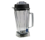 A transparent 64 oz Vitamix blender container with measurement markings, a handle on the right side, a black lid on top, and wet blade assembly visible at the bottom, set against a plain white background.