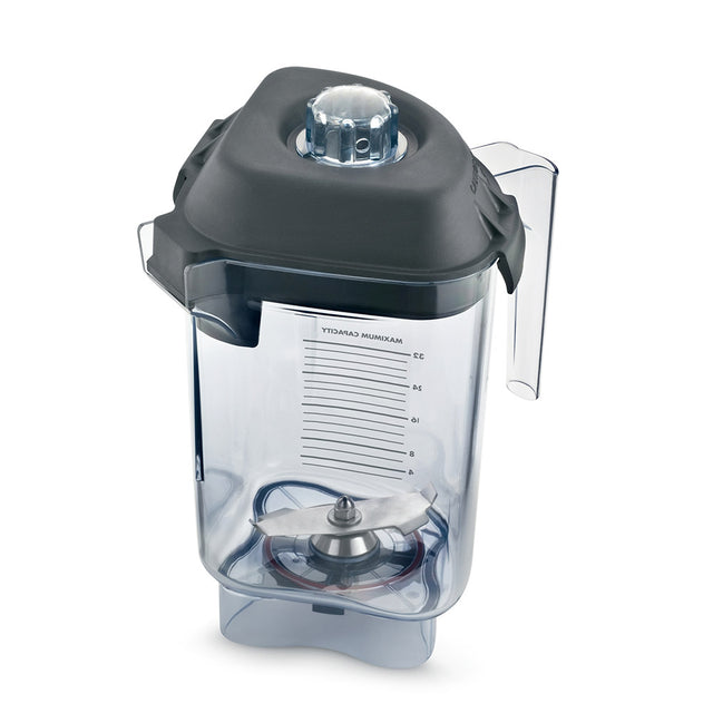 A transparent Vitamix blender container with clear measurement markings and a large Advance blade assembly inside. The 32 oz Tritan container features a black plastic lid with removable center cap, side handle, and a square base with curved edges.