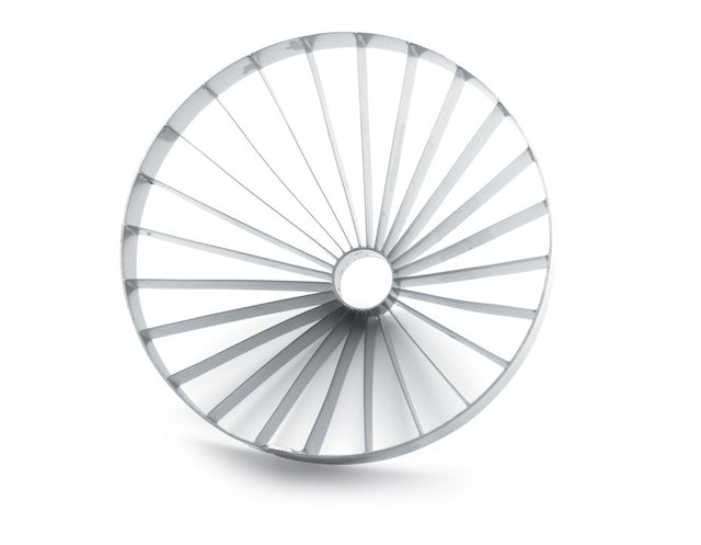 A circular metallic object, resembling a Vollrath blade assembly, features evenly spaced, thin radial spokes extending from a small central hole to the outer rim, creating a wheel-like pattern. The plain white background includes a subtle shadow beneath the object.