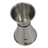 A stainless steel Japanese Jigger, double-sided and dishwasher safe, with engraved measurement markings for 15 ml and 30 ml, viewed from an angle that highlights both ends and its shiny metallic surface.