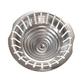 A top-down view of a round, stainless steel sink strainer with evenly spaced vertical slots around the edge and a slightly raised, domed center. The shiny surface and two small side tabs allow for easy removal or use as a replacement strainer cone.