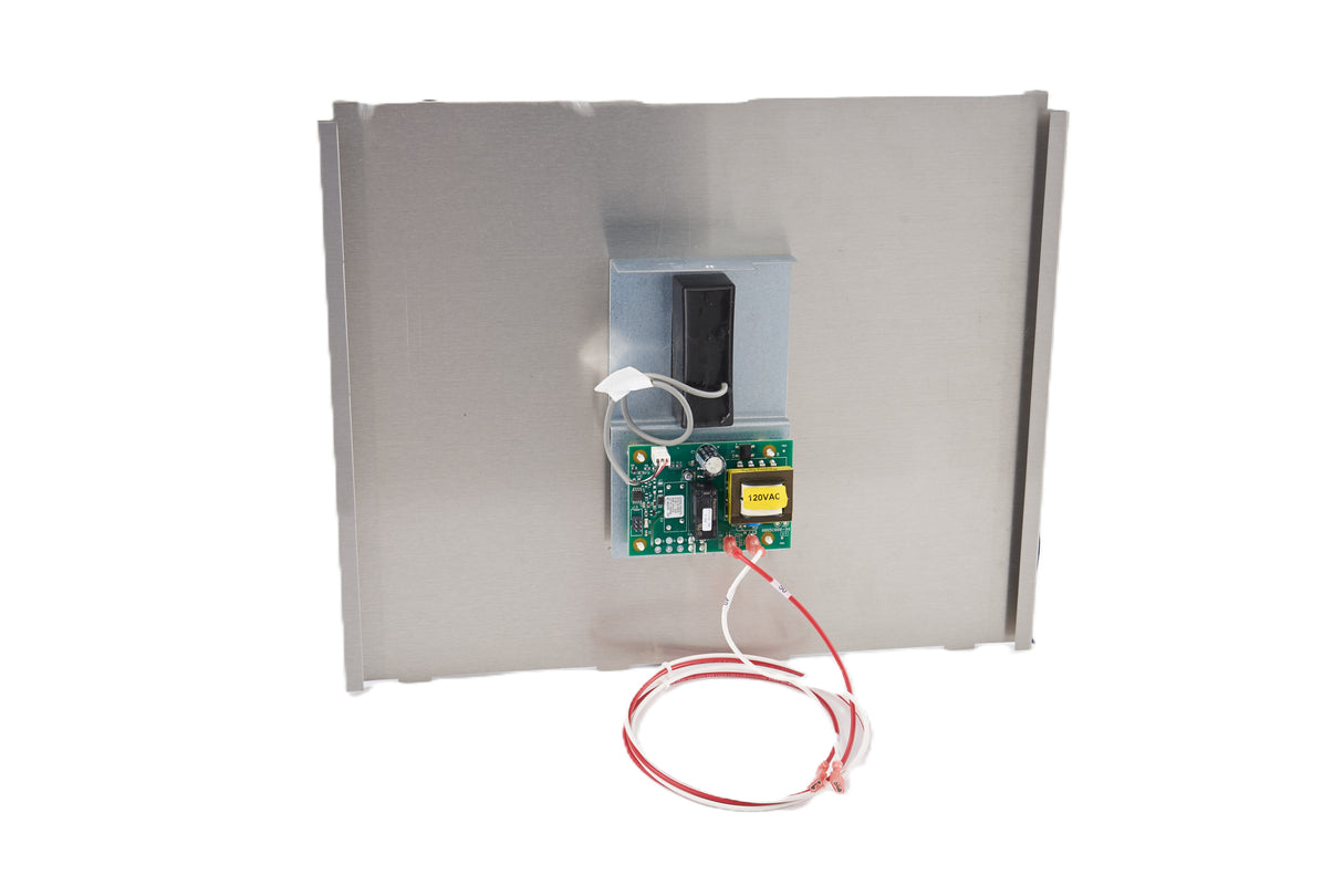 A metal rectangular panel with a mounted green circuit board featuring electronic components, a yellow transformer, and a black rectangular component above the board—part of the Manitowoc Touchless Dispensing Kit—with red and white wires loosely coiled at the bottom.