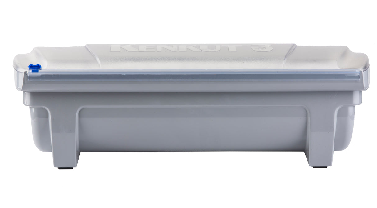 A rectangular gray plastic film dispenser, the KenKut 3 Dispenser features a translucent lid with a blue knob on the left side. “KENKUT 3” is embossed on the lid. The container stands on four short legs and has a slightly indented side design.
