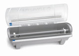 A gray and transparent KenKut 3 Dispenser with an open lid reveals an empty roller mechanism inside. This plastic film dispenser features blue locking clips on each end and four small compartments under the lid.