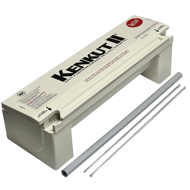 The KenKut II Dispenser is a white, box-style film or foil rolls dispenser with a hinged lid, printed instructions, and rod-like accessories. Its thin cutting strip makes handling plastic wrap easy—and it's dishwasher safe for convenient cleaning.