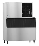A large commercial air-cooled ice maker with a stainless steel body, black vented panel on the upper right, and an angled black ice bin below. It stands on four black legs and produces crescent cube ice with a sleek, industrial design.