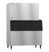 A commercial Hoshizaki stainless steel ice maker with a large black plastic front panel and four black legs, standing against a plain white background. The boxy, industrial design is ideal for restaurants and produces classic crescent cube ice.