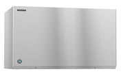 A large stainless steel Hoshizaki ice maker with a smooth, flat front surface. The brand logo is on the upper left, a blue circular certification label sits lower left, and it features a simple industrial design for producing crescent cube ice.