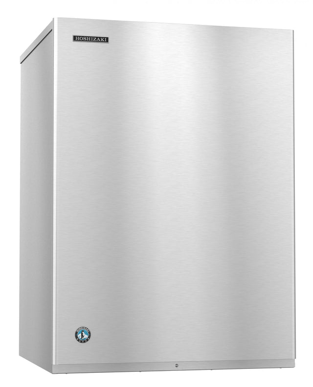 A large, stainless steel Hoshizaki ice maker with a smooth, flat front and sharp edges. The Hoshizaki logo is on the upper left, and a round blue certification badge is near the bottom left. It produces clear crescent cube ice and has a minimalist reflective surface.