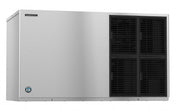A large, rectangular commercial Cube-Style ice maker with a brushed stainless steel exterior. The left side features a small Manitowoc logo, while the right has four black, vented grille panels. Perfect for stackable installation. Background is plain white.