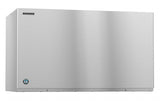 A large, rectangular Hoshizaki Cube-Style ice maker with a smooth, reflective stainless steel surface. The brand logo is in the top left corner, and a small round emblem sits near the bottom left. No visible controls or handles are present.