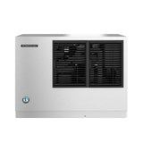 A stainless steel Hoshizaki Cube-Style Ice Maker features a rectangular shape, black front ventilation grills, a small blue and white logo on the lower left, and the Hoshizaki nameplate in the upper left corner. The background is plain white.