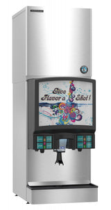 A stainless steel Hoshizaki soda fountain machine features a colorful display screen with “Give Flavor a Shot!” Bright swirls and splashes surround the text. Below are drink selection buttons, an ice maker dispenser, and a convenient cup rest.