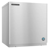 A stainless steel Hoshizaki ice maker with a plain smooth front, featuring a rectangular Hoshizaki logo at the top left and a round blue penguin emblem at the bottom right. The machine has a boxy, industrial design and produces crescent cube ice.