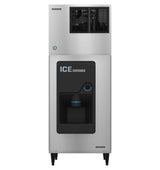A Hoshizaki stainless steel commercial ice dispenser with black vent grilles on top and front dispensing area labeled ICE DISPENSER. The Cube-Style ice maker stands on four legs, featuring a sensor or button and a catch tray below.