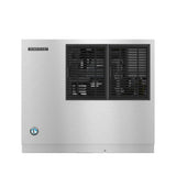 A stainless steel Hoshizaki Cube-Style Ice Maker with a rectangular shape. The left side displays the Hoshizaki logo above a blue certification emblem, while the right half features two black vent grilles revealing internal components. Background is plain white.