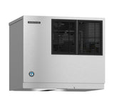 A stainless steel Hoshizaki Cube-Style Ice Maker with two black vented panels on the front. The rectangular unit is wall-mounted and features a branded logo and a certification sticker on the lower left corner.
