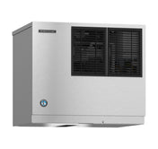 A stainless steel Hoshizaki Cube-Style Ice Maker with two black vented panels on the front. The rectangular unit is wall-mounted and features a branded logo and a certification sticker on the lower left corner.