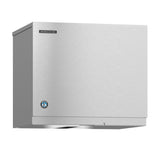A stainless steel Hoshizaki Cube-Style ice maker with a boxy, rectangular design. The smooth, brushed metal finish features a small logo and blue certification badge on the front panel. The unit is set against a plain white background.