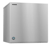 A cube-style Hoshizaki Ice Maker with a rectangular stainless steel body and smooth metal surface features the Hoshizaki logo on the upper left and blue emblem on the lower left, set against a plain white background.